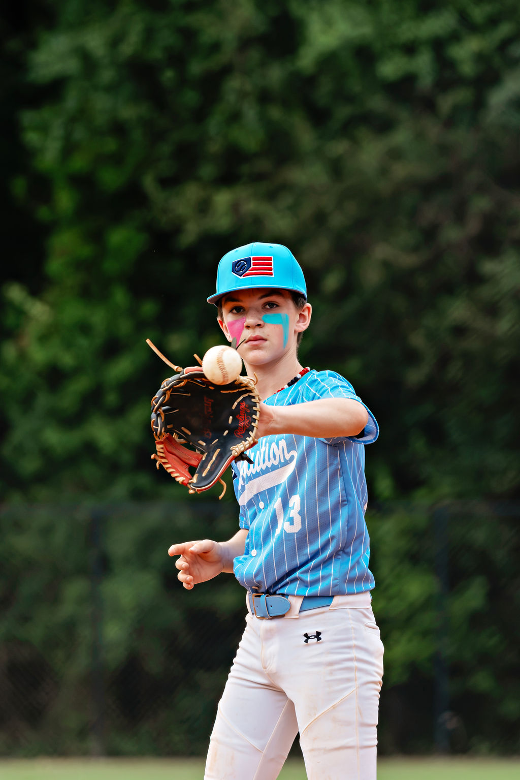 Mason Rue in the Revolution’s blue pinstripe uniform at Cherry Park.